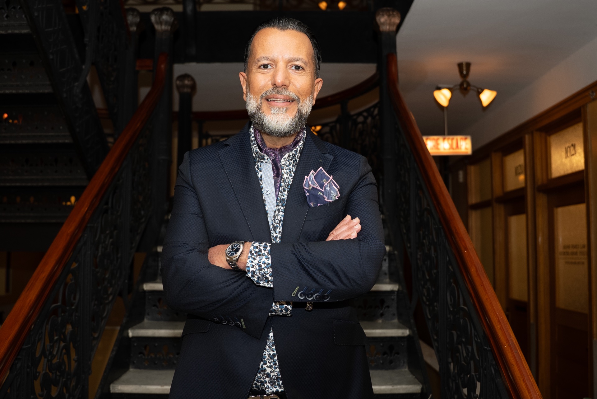 Kourosh Arami on the staircase of the firm’s Chicago Loop building